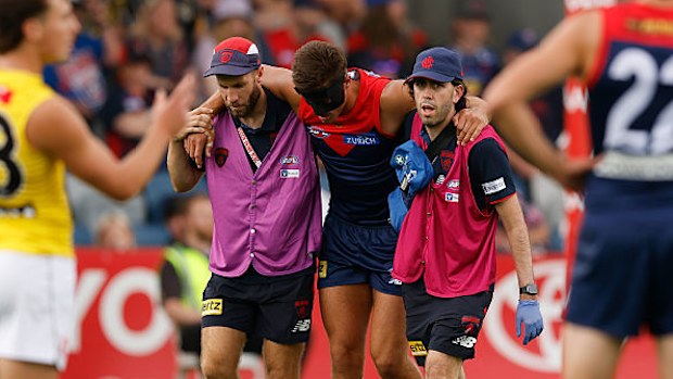 Luker Kentfield is seen with medical staff.