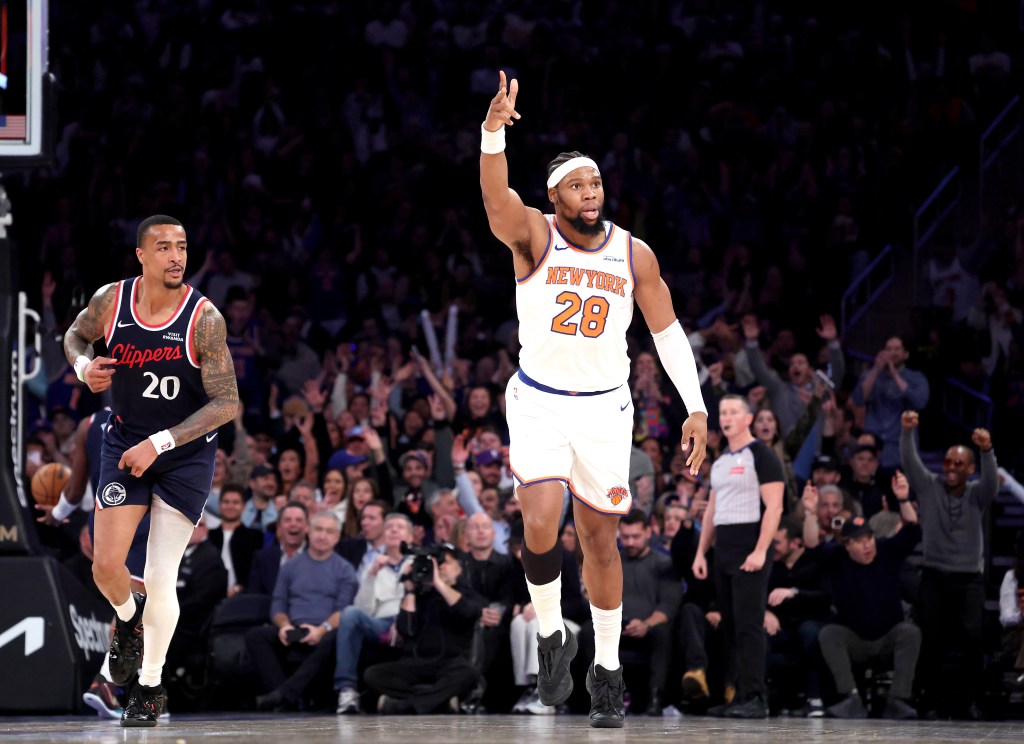 - New York Knicks forward Guerschon Yabusele #28 reacts after he hits a three-point shot over LA Clippers forward John Collins #20 during the fourth quarter.