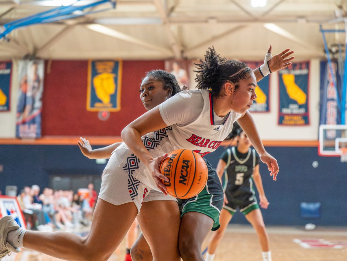 Freshman forward Jordan Washington pushes past Diablo defense during the game on Friday, Jan. 30 at home.