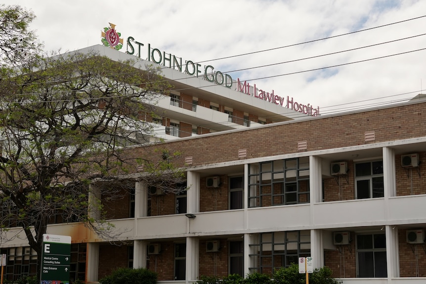 A photo of a hospital building with signage reading "St John of God Mount Lawley Hospital".