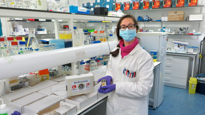 Rosa Santomartino, assistant professor of biological and environmental engineering in the College of Agriculture and Life Sciences, prepares samples for the launch to the International Space Station.