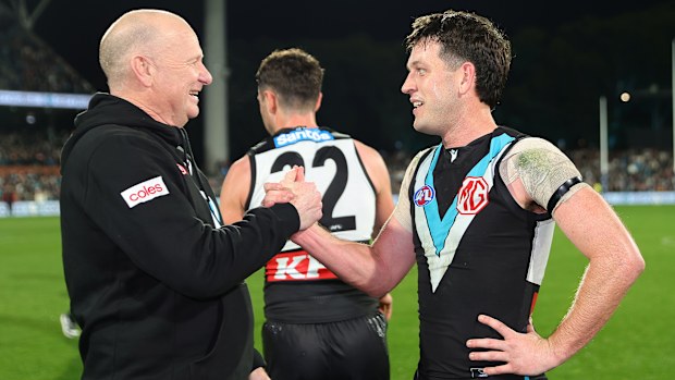 Zak Butters of the Power hugs Ken Hinkley.