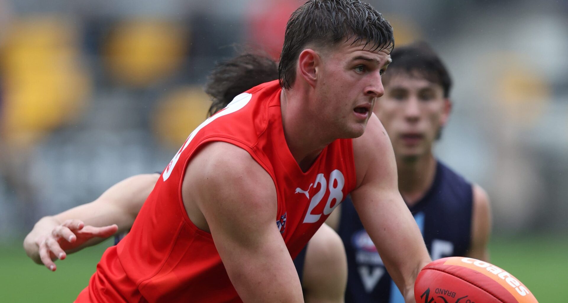 MELBOURNE, AUSTRALIA - APRIL 26: Zac Harding of the Young Guns handpasses the ball during the Young Guns 2025 series match between the Young Guns and the Victoria Metro U18 Boys at Melbourne Avalon Airport Oval on April 26, 2025 in Melbourne, Australia. (Photo by Rob Lawson/AFL Photos)
