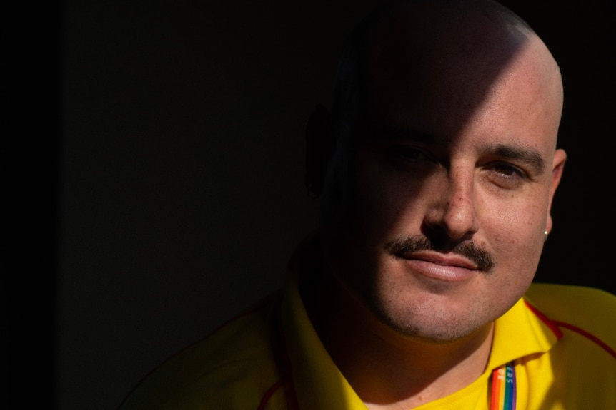 Man with face half in shadows