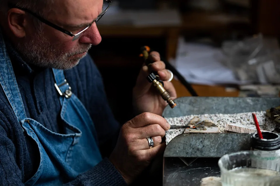 Silversmith Richard Moon pictured in a studio. 