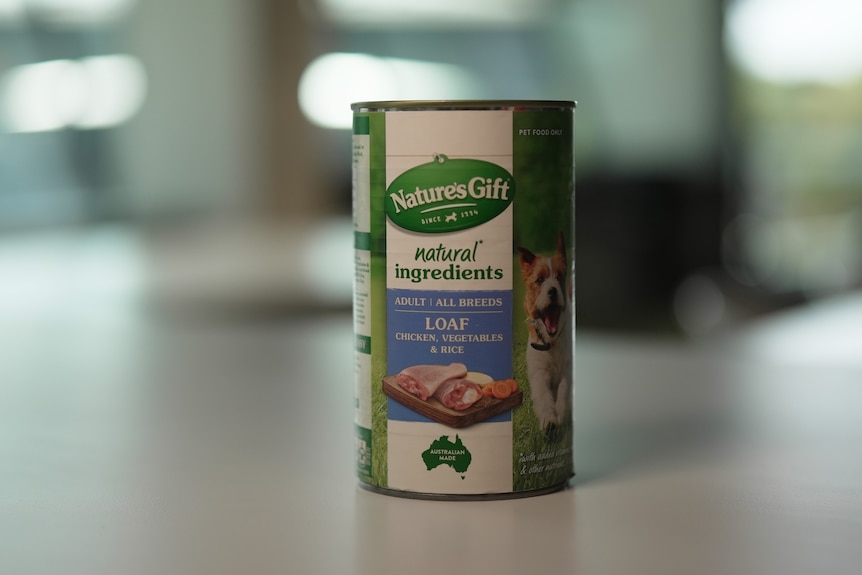 A can of Nature's Gift dog food on a table.