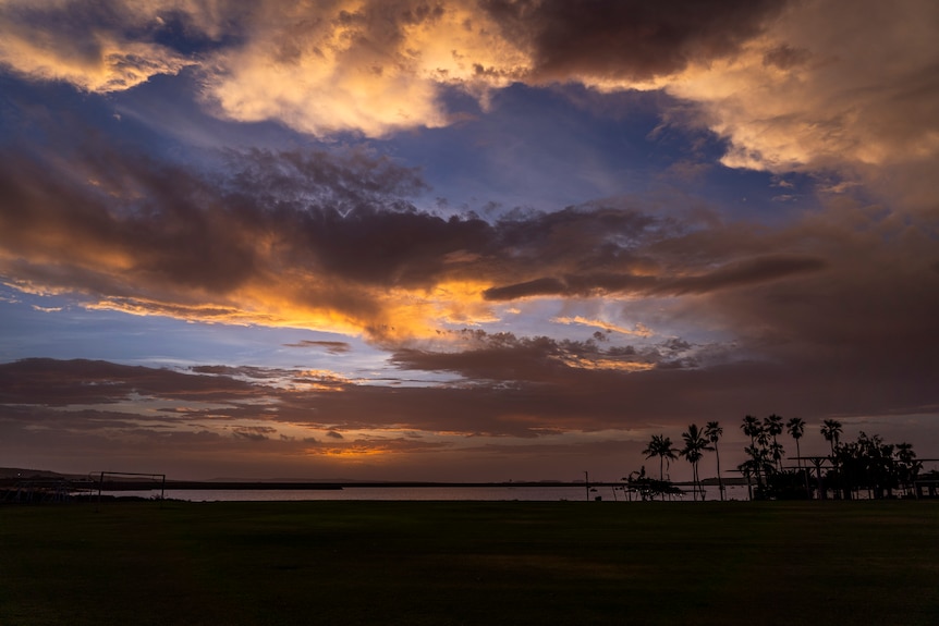 Cloudy hills and ocean ahead of cyclone impact