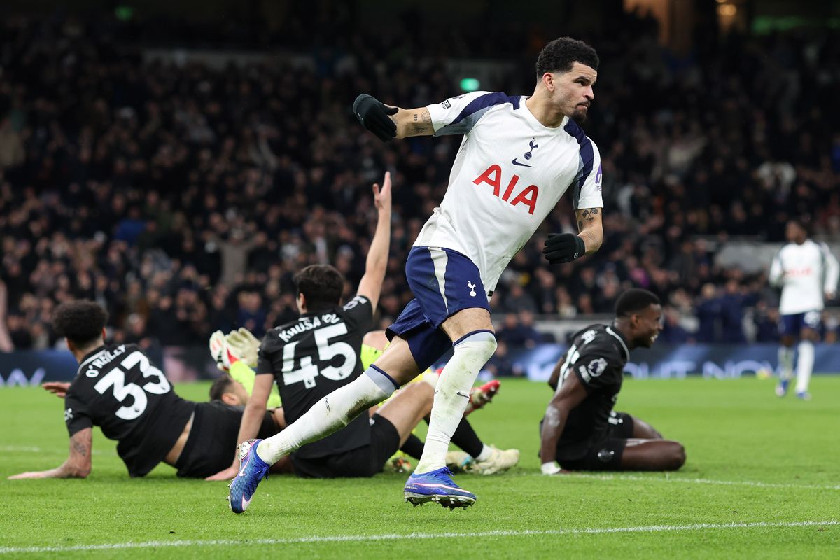 Dominic Solanke of Tottenham Hotspur leaves City players in a heap as he races back to his half after scoring their 1st goal during the Premier League match between Tottenham Hotspur and Manchester City 
