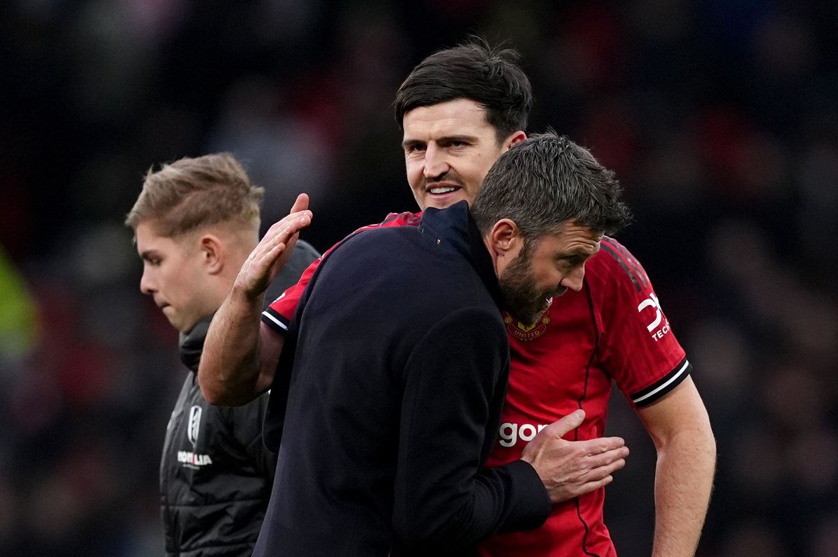 Michael Carrick embraces Harry Maguire