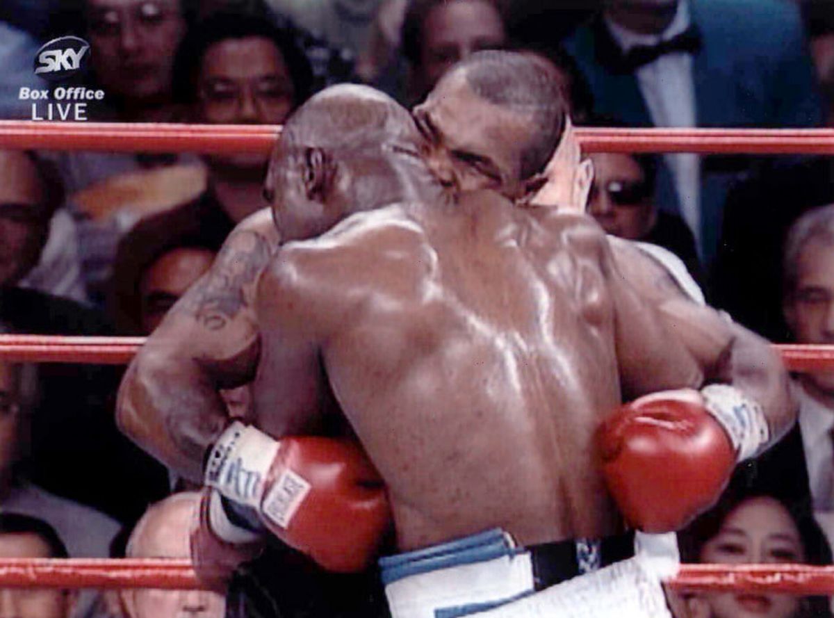 Mike Tyson bites Evander Holyfields ear during their 1997 fight
