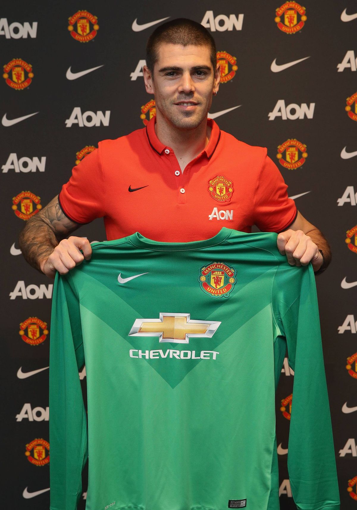 Victor Valdes of Manchester United poses after signing for the club at Aon Training Complex on January 8, 2015 in Manchester, England. 