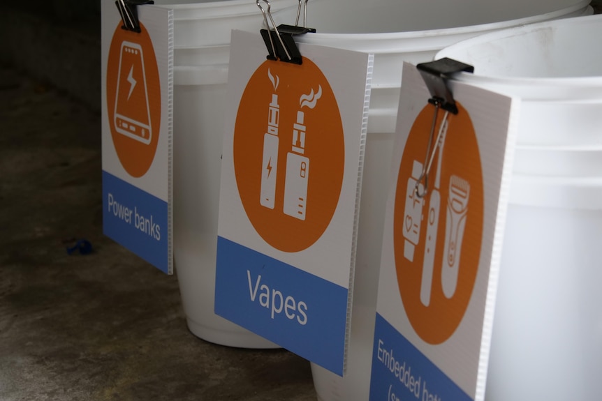 Three disposal buckets for battery items.