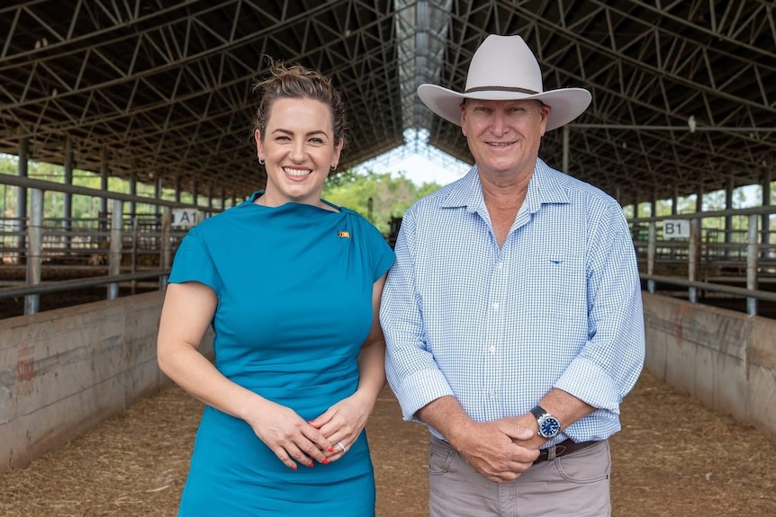 Chief Minister Lia Finocchiaro and David Connolly standing in cattle yards.