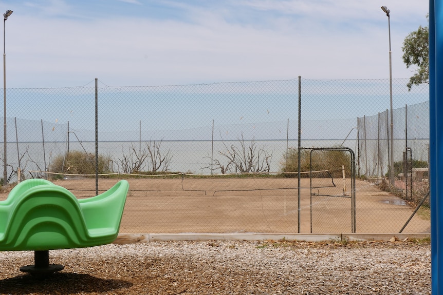 A parched tennis court in far west NSW with no greenery whatsoever