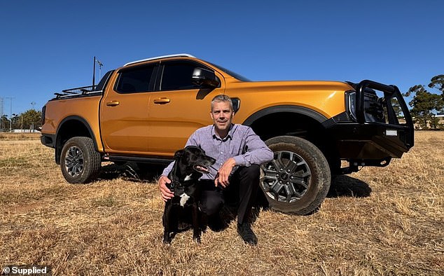 Kai Keller with his kelpie-cross Luna and their Ford Ranger