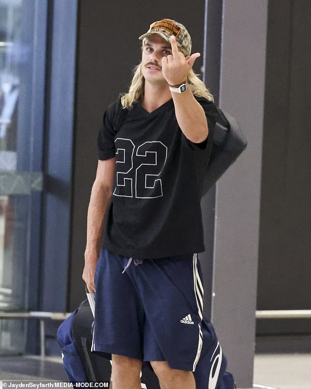 True to form, Smith looked less than thrilled to see our snapper, offering a one‑fingered salute