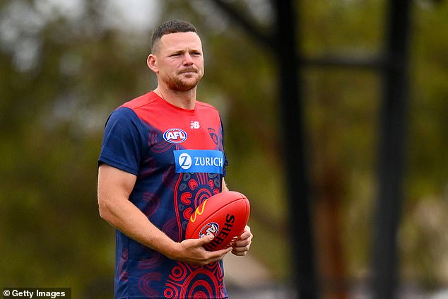 Melbourne veteran Steven May (pictured) is being investigated by the AFL Integrity Unit, as the premiership defender stays away from Demons training