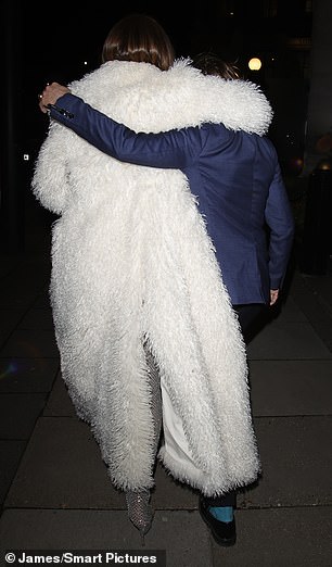 She was seen wrapping her arm around her husband Michael's shoulders as they left the venue together