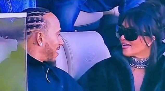 Kim Kardashian and a seemingly besotted Hamilton at the Super Bowl - she in a black faux fur jacket and him with a sparkling diamond earring