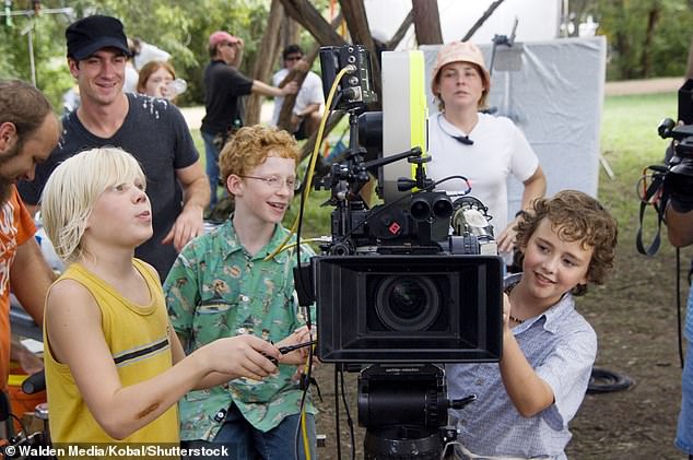 Garrett (front left) and the rest of the child cast of How To Eat Fried Worms were honored with the award for Best Young Ensemble Cast at the 28th Young Artist Awards in 2007; pictured on set with Andrew Gillingham (front center) and Ryan Malgarini (front right) in 2006
