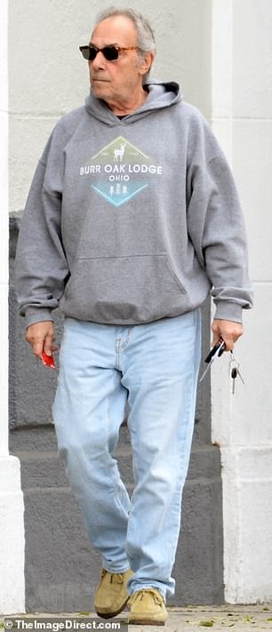 Now aged 69, he was glimpsed this week looking sprightly as ever as he surfaced for a grocery run in a casual ensemble of jeans, a hoodie and tortoiseshell shades