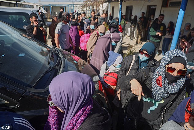 Kirsty Rosse-Emile is pictured last week, bottom right with a blue and white head scarf, during a botched attempt to escape Syria and return to Australia
