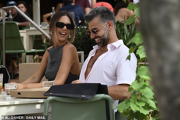Bec and Joel appeared to be very friendly during their lunch, sitting close to each other as they happily chatted with friends