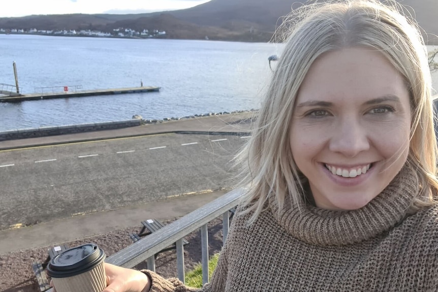 Close up of a woman with blonde hair at the beach. 