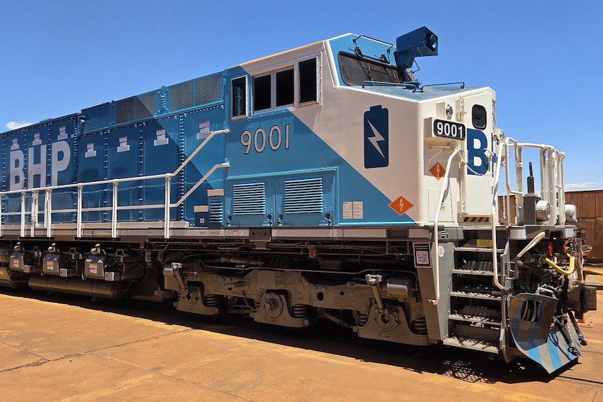 A blue and grey locomotive.