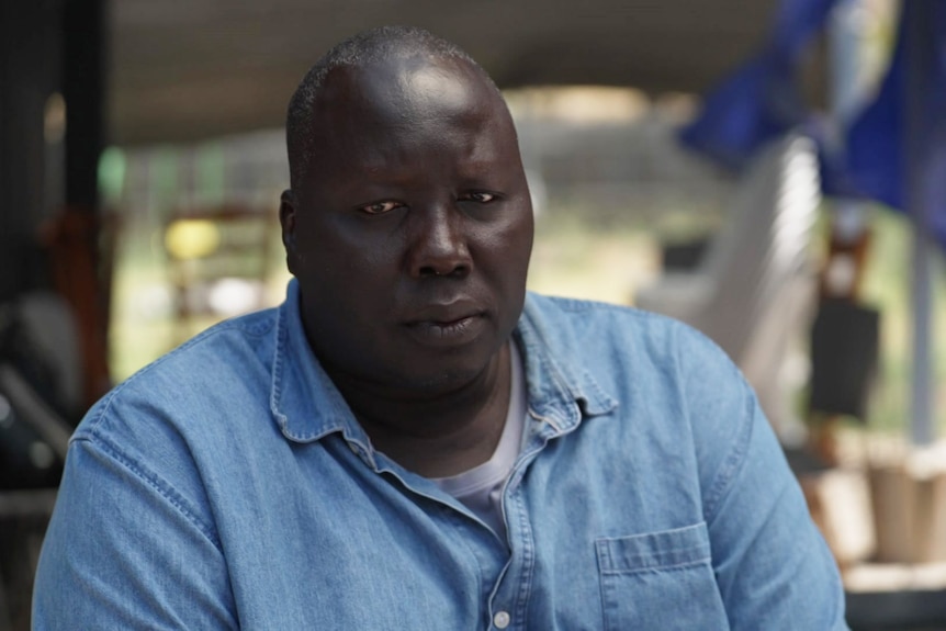 A man wearing a collared shirt.