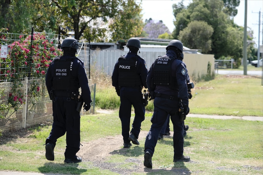 nsw police dressed in riot gear outdoors as pasrt of operation soteria