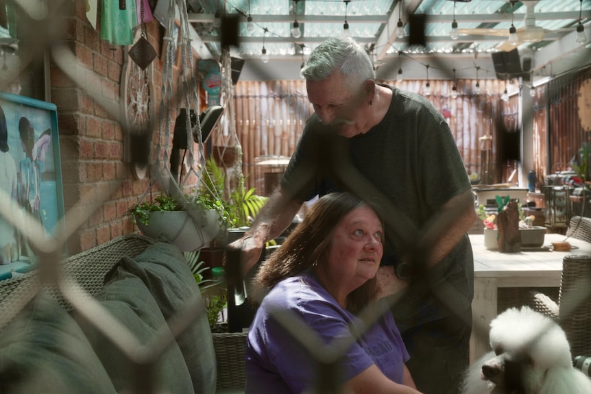 Trevor Cox brushing Marie's hair