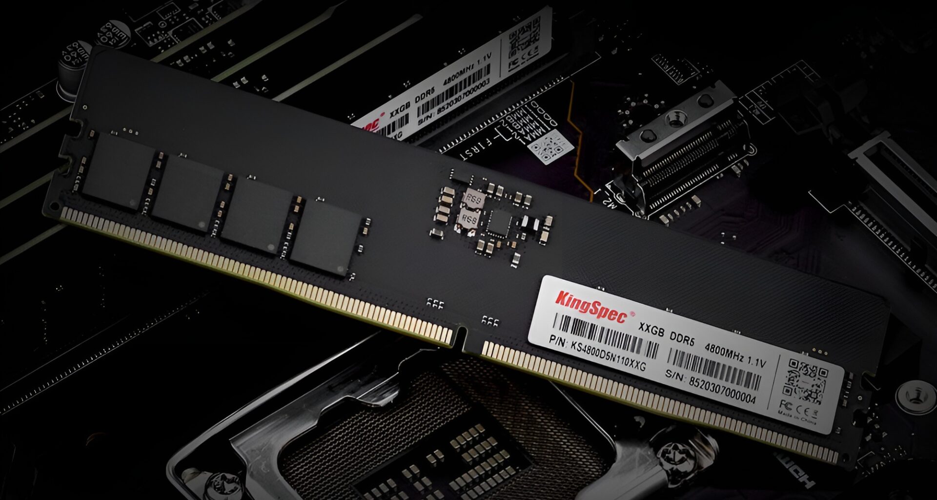 A KingSpec X16GB DDR5 4800MHz RAM module labeled '1.1V' is placed above an open CPU socket on a motherboard.