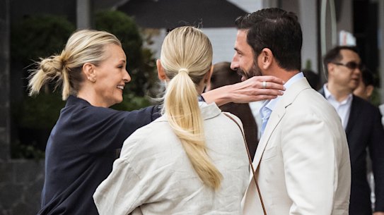 Sarah Murdoch reaches out to embrace Ryan Stokes at the Australian Open.