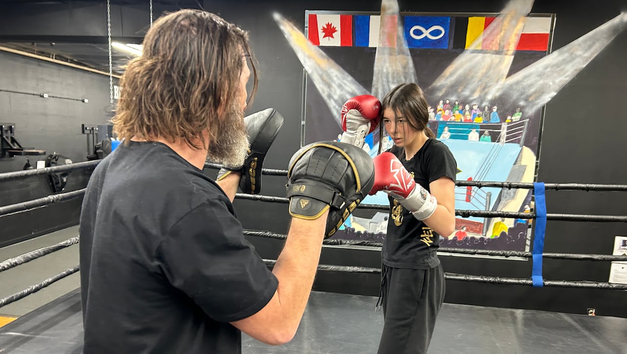 A girl in a boxing ring