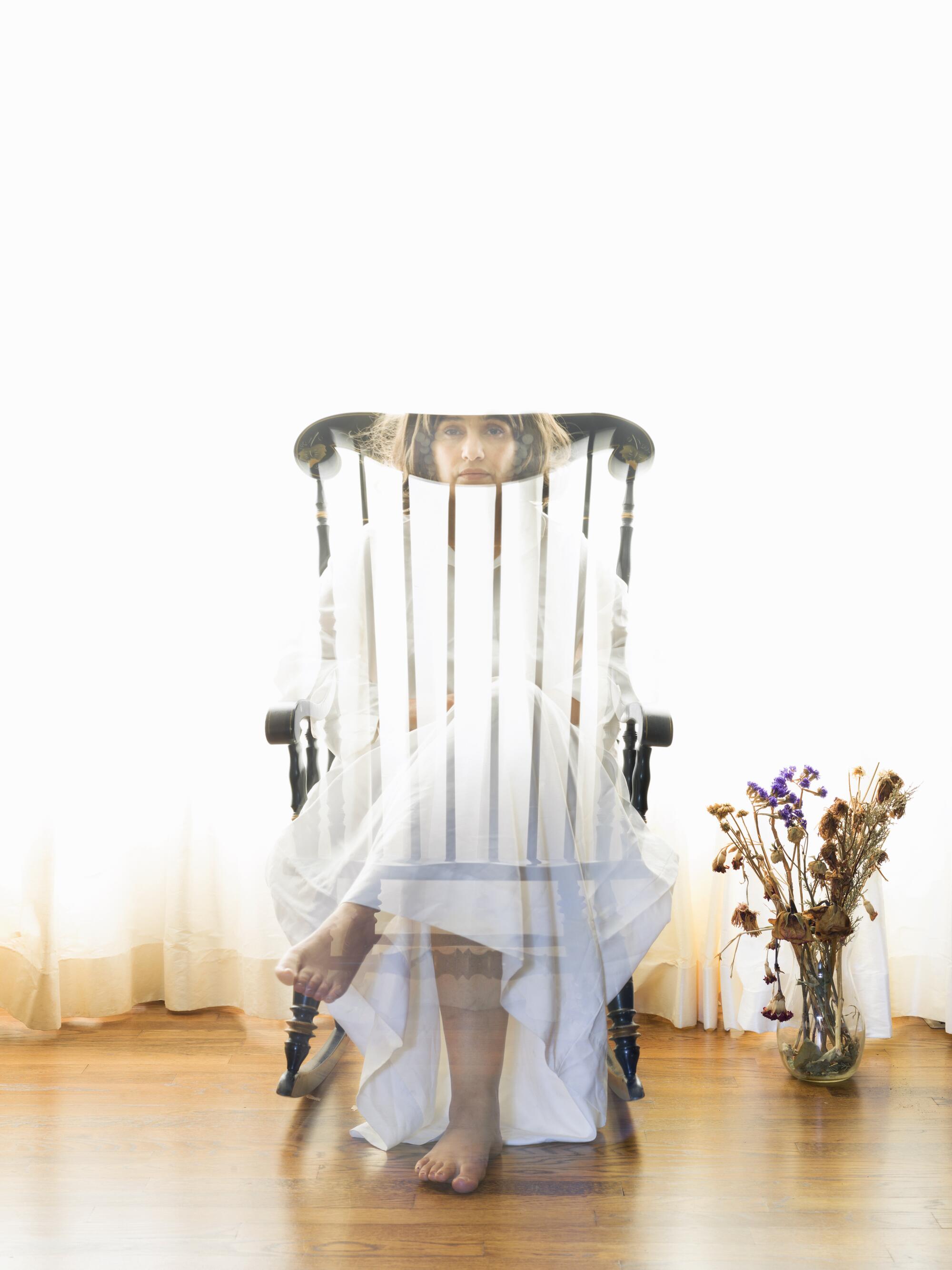 Asiya Al. Sharabi's photo of a transparent figure in a rocking chair. 