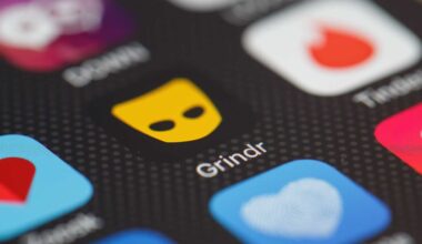 The "Grindr" app logo is seen amongst other dating apps on a mobile phone screen.