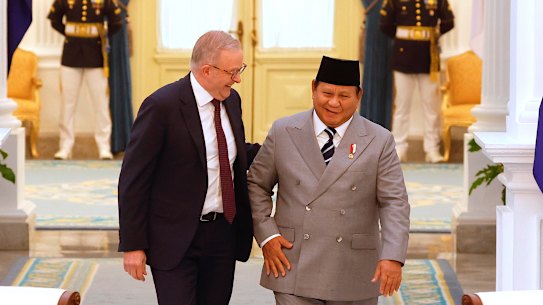 Australia’s Prime Minister Anthony Albanese (L) and Indonesia’s President Prabowo Subianto walk during their meeting at Merdeka Palace in Jakarta, Indonesia.