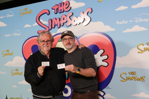 Matt Groening, left, and Matt Selman arrive at a celebration for "The Simpsons" 800th episode, "Irrational Treasure," on Friday, Feb. 6, 2026, at The Fonda Theatre in Los Angeles. (Photo by Andrew Park/Invision/AP)