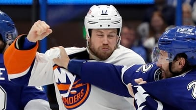 Matt Martin of the Islanders vs. Luke Schenn of the Tampa...