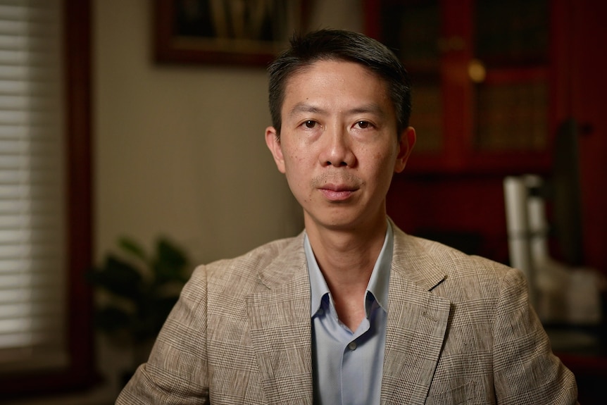 Man in suit staring at camera