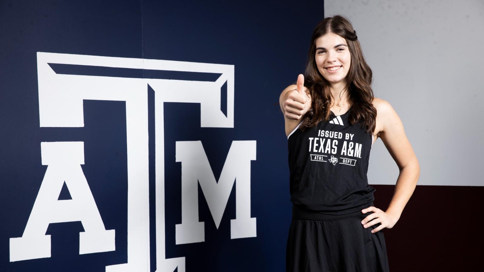 Lucciana Perez volleys against Ohio State at the ITA National Team Indoor Championship in Evanston, Illinois