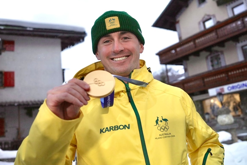 Cooper Woods shows his medal.