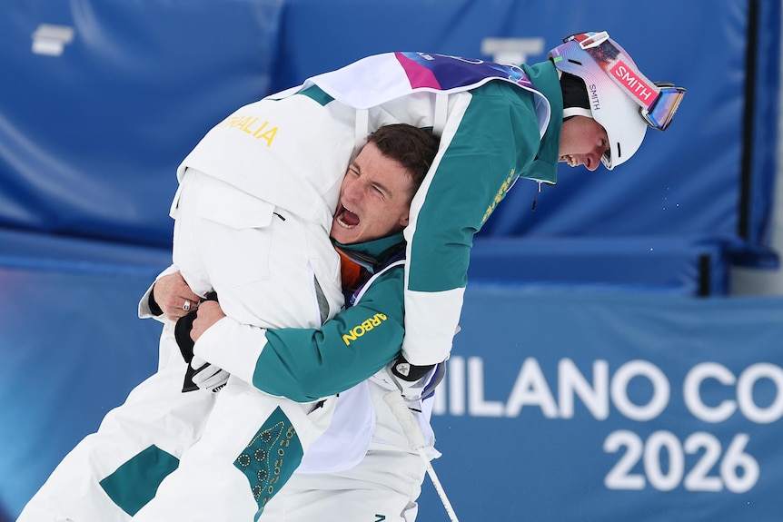 Matt Graham lifts Cooper Woods in the air.