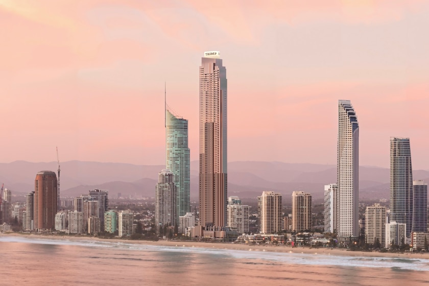 A skyline with a very tall Trump Tower in the middle.