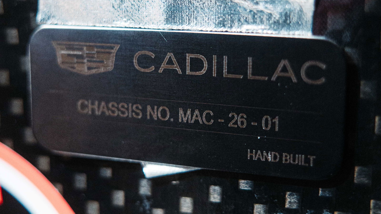 A close-up image of the Cadillac MAC-26 name plate.