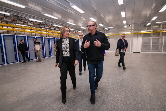 Premier Jacinta Allan with NextDC chief executive Craig Scroggie in one of the data centre’s Melbourne premises. Economic Growth and Jobs Minister Danny Pearson is directly behind them.