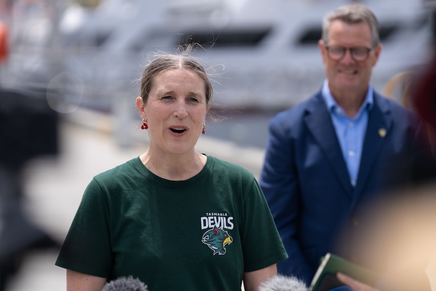 Woman talks to media at press conference