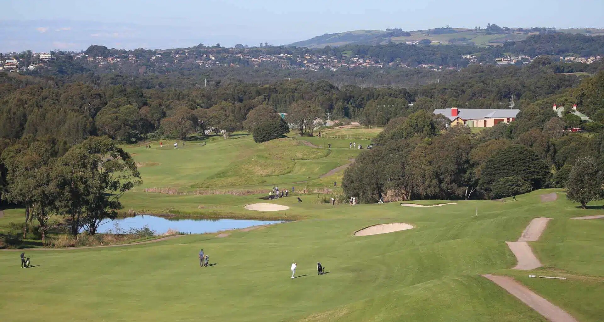 a group of people on a golf course