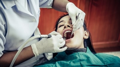 Here are 9 questions to ask your dentist before treatment, as recommended by Dr Mark Burhenne. (Freepik)